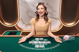 Live Blackjack dealer at jawara slot studio with HD multi-camera setup showing dealt cards